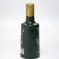 Lateral izquierdo de botella de aceite de oliva virgen extra Temprano Ad-Morum (AOVE temprano).